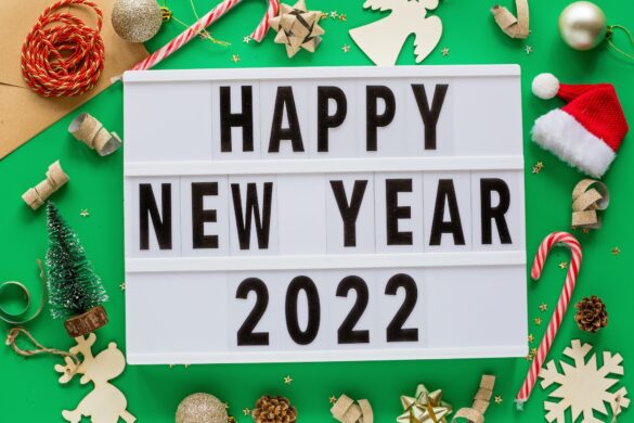 Happy New Year 2022 Flat Lay on Green Background