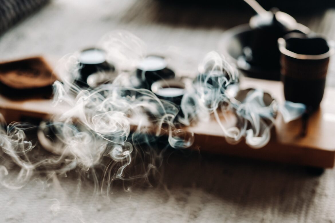 Tea ceremony with smoking incense. Incense stick and tea ceremony